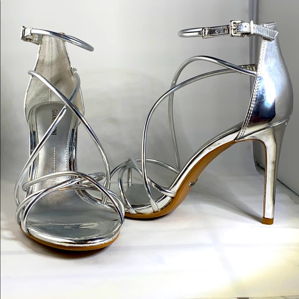 Silver Patent leather strappy heels.